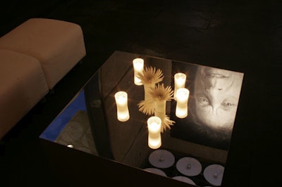 Mirror-topped tables in the cocktail space reflected Close's portrait of Philip Glass.