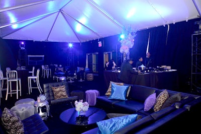 Lounge areas with black leather-upholstered couches and chrome accents provided extra room for guests to mingle with their cocktails and dance to music from the DJ.