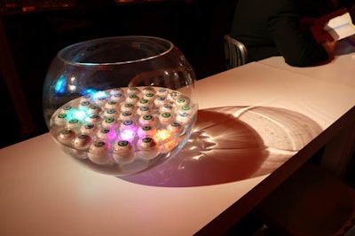 Toy eyeballs and LED ice cubes floated in large glass bowls that adorned the cocktail tables.