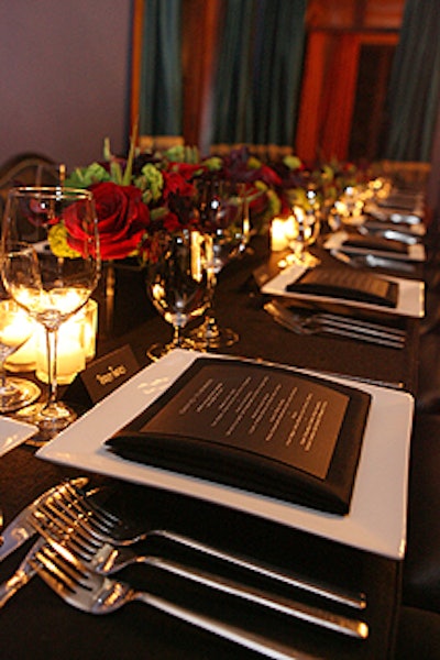 A small group of 30 guests dined at dark-clothed tables before hundreds more joined the group for the party.