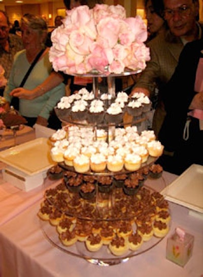 Stella's Sweet Shoppe created a cupcake tower topped with pink roses.