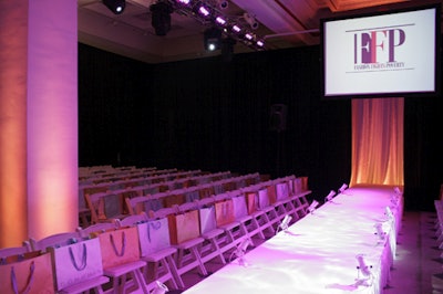 Guest chairs (with gift bags) lined the Fashion Fights Poverty runway.