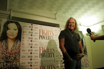 Lynyrd Skynyrd member Rickey Medlocke posed in front of the artful step-and-repeat.