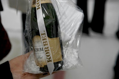 Prizes granted to those who answered curling trivia questions correctly included mini Korbel bottles with branded brooms.