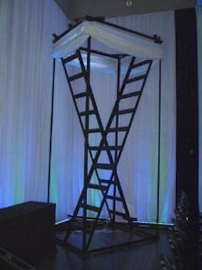 Theatre 2.0 performance artists, working in large shadow boxes, wound themselves around these ladders during the dinner hour.