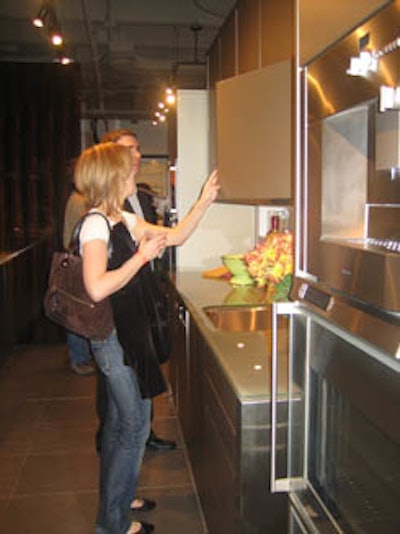 Attendees inspected the high-end home furnishings on display.