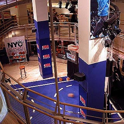 The NBA Store's downward spiral ramp ends at a mini-basketball court.
