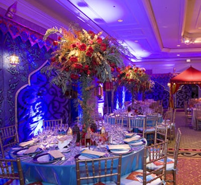 YouthAIDS gala producers wrapped candelabras in greenery to created towering centerpieces.