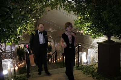 Guests entered the library through an arch of greenery.