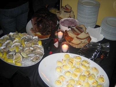 A casual buffet of ham, deviled eggs, and oysters satisfied the crowd.