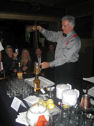 Pouring flaming scotch from one mug to another, mixologist Dale DeGroff concocted a Blue Blazer, one of Jerry Thomas's original cocktails.