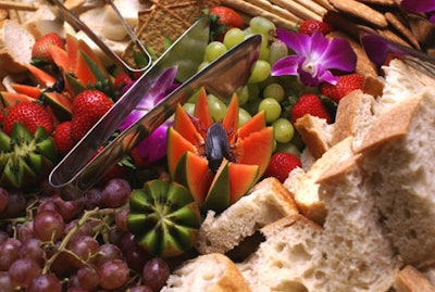 Caterers made their dishes more festive by adding faux spiders, insects, and mice to the display.