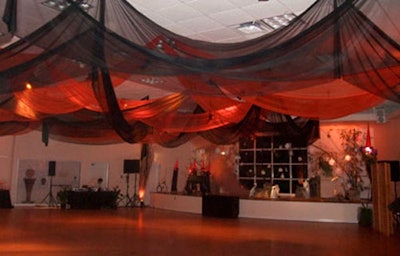 The inside dance area featured an elaborate cemetery scene and orange and black linen that hung from the ceiling.