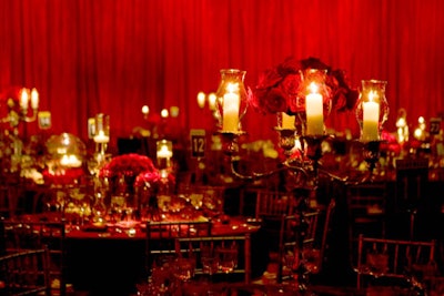 The candelabra centerpieces were accented with bouquets of deep red roses.