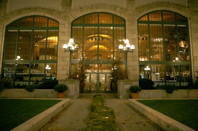 A curving structure of moss led to the venue's entrance, which was surrounded by tall birch trees for the event.