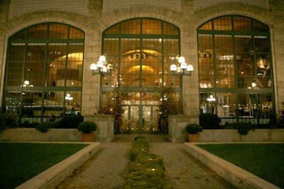 A curving structure of moss led to the venue's entrance, which was surrounded by tall birch trees for the event.