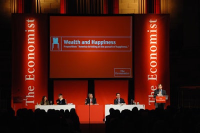 The red-and-white stage set was evocative of both The Economist's logo and the invite.