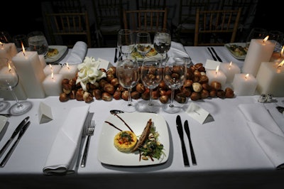 Arrangements of white candles and lilies with tulip bulbs graced tables.