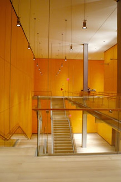 An expansive staircase leads to the lower-level space.