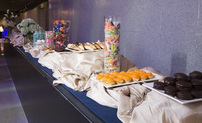 Guests could help themselves to a dessert buffet of classic sweet treats. Elegant floral arrangements by Amaryllis featured calla lilies and hydrangea.
