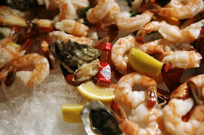 Wolfgang Puck Catering placed tiny tabasco bottles among the giant raw bar of shrimp, lobster, and oysters.