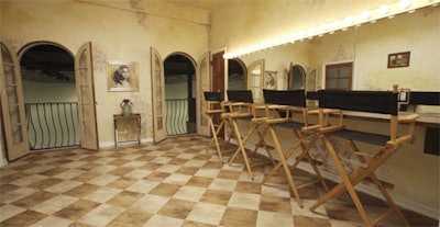 The upstairs staging and makeup room is decked in warm tones.