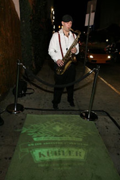 A sax player welcomed guests into the venue.