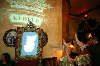 TV screens throughout the venue featured video loops of green fairies.
