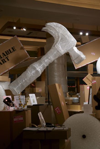 A large hammer made from bubble wrap loomed over the cocktail area.