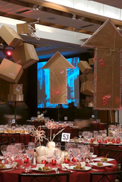 At dinner, towers of boxes and arrow-shaped packages hung over the tables.