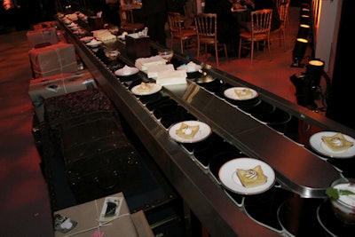 Desserts were served atop a mini conveyor belt, mimicking a luggage carousel.