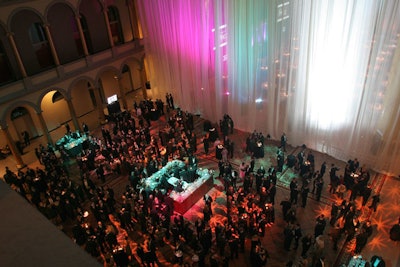 In keeping with the event's color theme, Kansas-based DSS Inc. lit the National Building Museum's grand columns in red, green, and white.