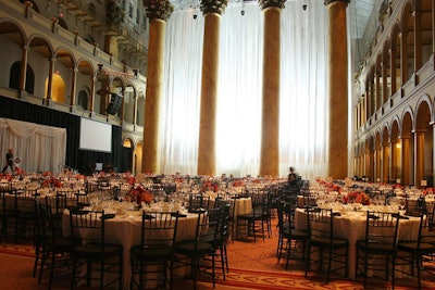 Floor-to-ceiling white crepe drapery separated the dining room from the cocktail reception area, which also held the post-dinner reception.