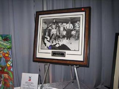 One of the silent-auction items included an autographed photo of Muhammad Ali with the Beatles.