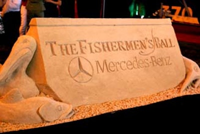 Team Sandtastic created an elaborate sand sculpture with the Fisherman's Ball logo to welcome guests onto the field.