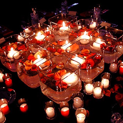Some of the centerpieces at the Henry Street Settlement's Casablanca-themed benefit at the Puck Building consisted of nine square glass vases filled with water, flowers and candles.