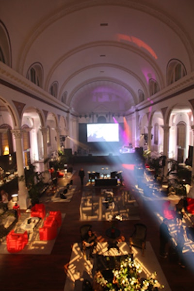 Patterned lighting shone on seating clusters.
