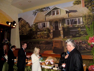 Guests grazed at a buffet, behind which stood a giant image from the movie set.