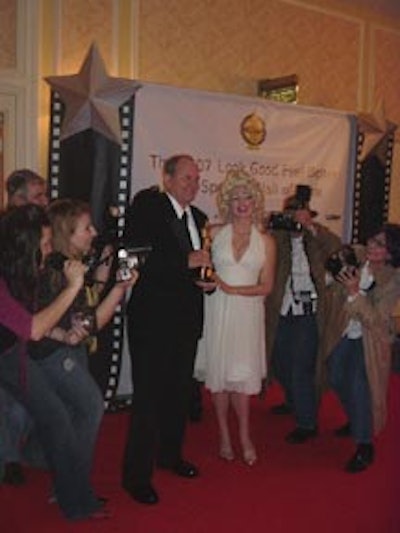 Academy Award Winner Michael Westmore posed with a Marilyn Monroe impersonator.
