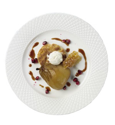 Well Dunn Catering in Washington, D.C., offers a roasted Anjou pear crisp. Chef Michael Payne places the pear on a caramelized puff pastry raft and pairs it with house-made Hawaiian white-honey ice cream and reduced blood-orange puree. The dish is garnished with pomegranate seeds and a sliver of honeycomb.