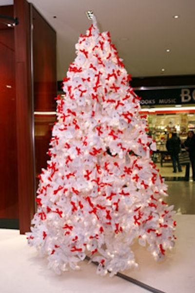 Beside the house, a tree covered in paper espresso cups brought attention to Illy's Cup of Kindness Campaign. Visitors can make donations on-site.