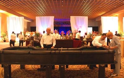White curtains resembling the sails of a fleet of ships separated the gaming area from the main dining room.