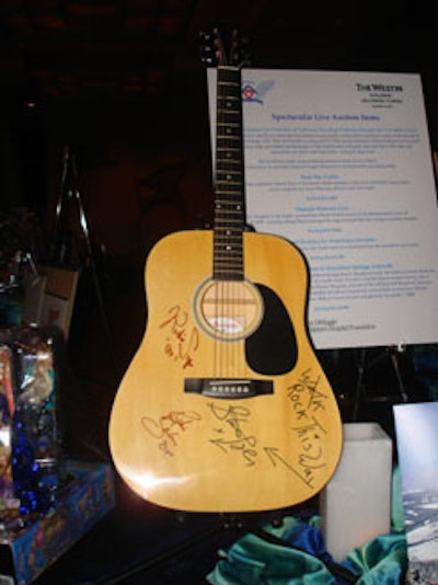 One of the most coveted silent-auction items of the night was an acoustic guitar signed by Steven Tyler, Richie Sambora, and Richie Supa.