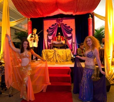 Inside the Arabian tent, a performer dressed as Aladdin watched as three belly dancers swayed to the rhythms of Gurpreet Chana and his tabla ensemble.