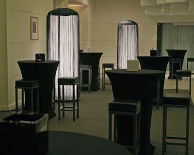 Contemporary stools and black-spandex-covered cruiser tables populated the second-floor cocktail lounge.