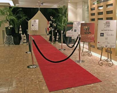 A red carpet bordered by black velvet rope led the way to the entrance of the dining hall.