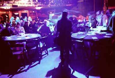 Guests sat at tables topped with black and white linens for the ceremony.