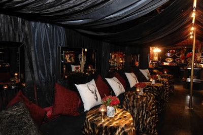 Oversize stag-head pillows were placed along a banquette in the dimly lit 'hunters lodge.'