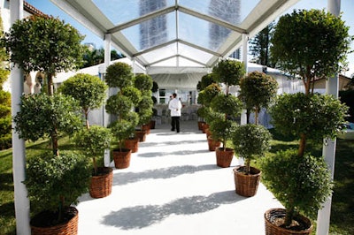 Karla Conceptual Event Experiences created a foliage-lined entrance leading into the tent.