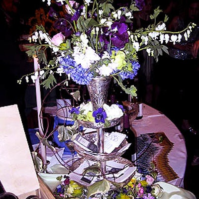 Ned Kelly of Ned Kelly Designs designed flower arrangements (on units that doubled as business card holders) for Xavier's Restaurant's tasting table.